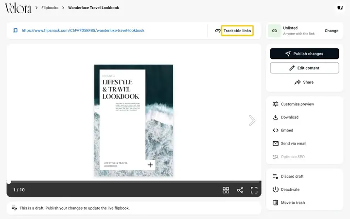 A flipbook page in Flipsnack with the Trackable links button highlighted next to the flipbook link